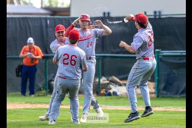 Greg Hoogeveen photos/Redbirds1 Redbirds players run onto the field to celebrate after beating Jackson 12-2 in final game of the third place series. Ethan Beyer, No. 24, drove in the final run to seal Luverne’s spot in the 2026 MBA State Tournament. 