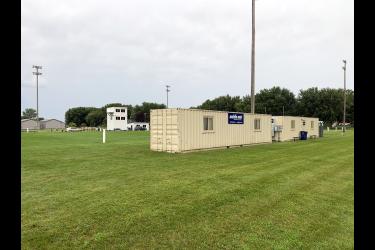 Three portable construction office containers were recently moved to the Hills-Beaver Creek football field for use as locker rooms as construction continues at the Hugo Goehle gymnasium in Hills. The containers have heat and air conditioning. Setup and lease of the containers will cost the district $10,000 for three months of use. Mavis Fodness/Rock County Star Herald Photo