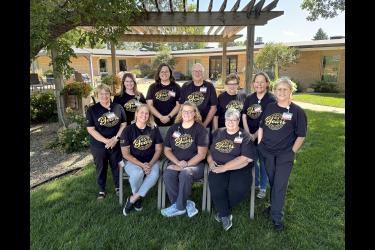 The Hills Tuff Memorial Home staff members all played a role in the facility’s perfect five-star rating through the Centers for Medicare and Medicaid Services. Seated are (from left) Tuff Home administrator Katie Kendall, director of nursing Dana Huisman, executive director Jane Blank, (standing) Glenda McGaffee, life enrichment director Jocelyn Jacoby, social services designee Emily Baatz, Dennis Boese, environmental services director Judy DeNoble, dietary manager Kelly Hellerud and Sandy Bush. Not picture