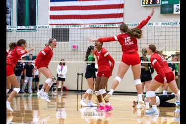 Greg Hoogeveen photo/0917LHSVB1 The Luverne Cardinals celebrate their third set win against Pipestone Tuesday, Sept. 10. Pipestone took the first two sets and the Cardinals rallied to capture the next three for the win.