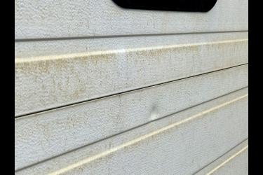 White garage doors on the Den Herder Construction property near The Lake in Luverne were coated in a brownish-yellow substance in the spring of 2018. Rock County Star Herald File Photo