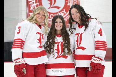 Greg Hoogeveen photo/100 points Three LHS girls’ hockey players recently reached the 100-point career marks. They are left, junior Tenley Behr, senior Ella Apel and junior Izzy Steensma.
