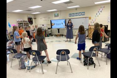 Luverne Elementary music teacher Kira Degerness (center, at piano) rehearses with the Luverne Street Music Songbirds Children’s Choir Sept. 30 in her music room. The 12-member choir will debut Sunday, Dec. 7, in a grand finale performance at the Palace Theatre in Luverne. Pictured from left are Oliver Prahm, Liam Strassburg, Eden Uithoven, Emery Sandager, Hattie Sandbulte, Ingrid Sandager, Amelia LeBrun, Helena Prahm, Presley Mundt, Ava Lafrenz and Alex Bjorkman. Missing is Maria Sandager.