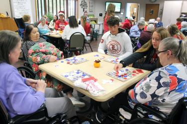 In a spirited game, (from left) Kathryn Bruxvoort, Patricia Reverts, Henry Hartquist, Anika Boll and Sonja Goembel watch their bingo cards closely for a possible prize that included Luverne Cardinal T-shirts. Mavis Fodness/Rock County Star Herald Photo