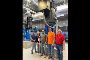From left are City Administrator Jill Wolf, water operator Aaron Altman, Mayor Pat Baustian (who serves on Lewis & Clark’s Board of Directors) and water operators Aric Uithoven and Joe Ahrens.