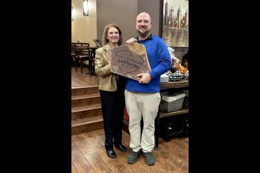 Chamber Board President Tony Schomacker (right) presents Marilyn Bloemendaal with a Sioux quartzite rock etched with her honor, “Chamber Member of the Year,” during Monday night’s reception in Sterling’s Grille and Restaurant. Lori Sorenson/Rock County Star Herald Photo