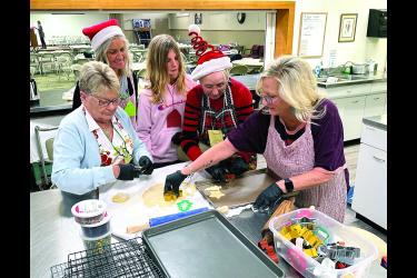 During the “Declutter Retreat” Saturday Jan Israelson, (from left) Brenda Wessels, Amara Antoine, Marlene Wassenaar and Staci Zwaan cut out cookies to prepare for decorating.Lori Sorenson/Rock County Star Herald Photo