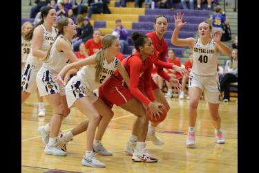 Senior Kira John protects the ball under the basket against Central Lyon Monday, Nov. 27, in Rock Rapids. The Cardinals fell to the Lyons 56-33 in the game.