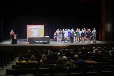 National Honor Society member Julia Hoogland (far left at podium) leads the pledge for the new inductees. Mavis Fodness/Rock County Star Herald Photo