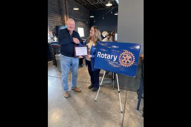 Gregg Gropel of Luverne is presented with the Rotary District 5610 “Rotarian of Distinction” recently by fellow member Karen Willers. The district consists of 39 clubs. Submitted Photo