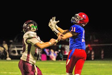 Samantha McGaffee photo/HBCFB1 Patriots junior Maddox Metzger looks for a pass against Mountain Lake Oct. 14 on the road. H-BC improves to 7-0 for the season.