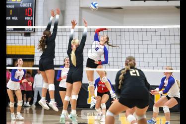 Greg Hoogeveen photo/HBCVB1 Patriots senior Ava Steinhoff prepares to spike the ball against Westbrook-Walnut Grove with teammates ready for any deflections at home Thursday, Oct. 8. The Chargers won the match against H-BC in three sets. 