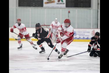 Senior Patrick Kroski splits the Marshall defense as he heads toward their goal in Luverne Tuesday, Nov. 28. The Cardinals pulled off an exciting 2-1 win in overtime in their season opener game.
