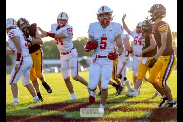 Greg Hoogeveen photo/0910 LHSfootball1 LHS senior Matthew Gangestad, No. 5, breaks through the Blue Earth defense for Luverne’s first touchdown of the season. LHS beat the Bucanneers 41-0 in the game.