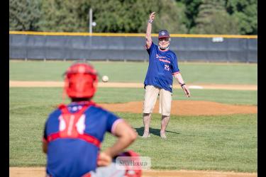 Greg Hoogeveen photos Below: Betty Mann throw out the first pitch to catcher Braydon Ripka to open the game.